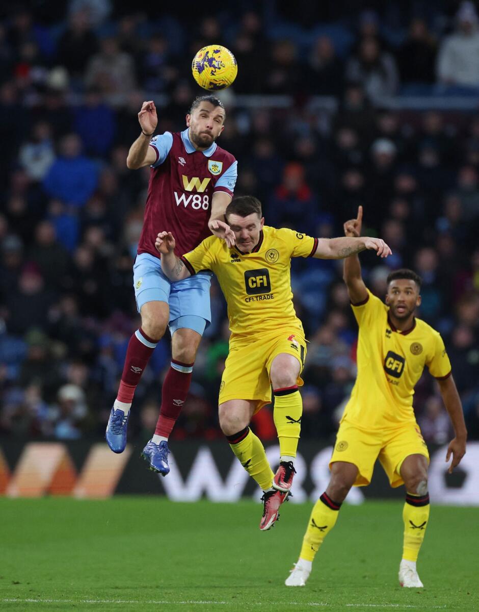 Burnley's Jay Rodriguez in action with Sheffield United's John Fleck - Reuters