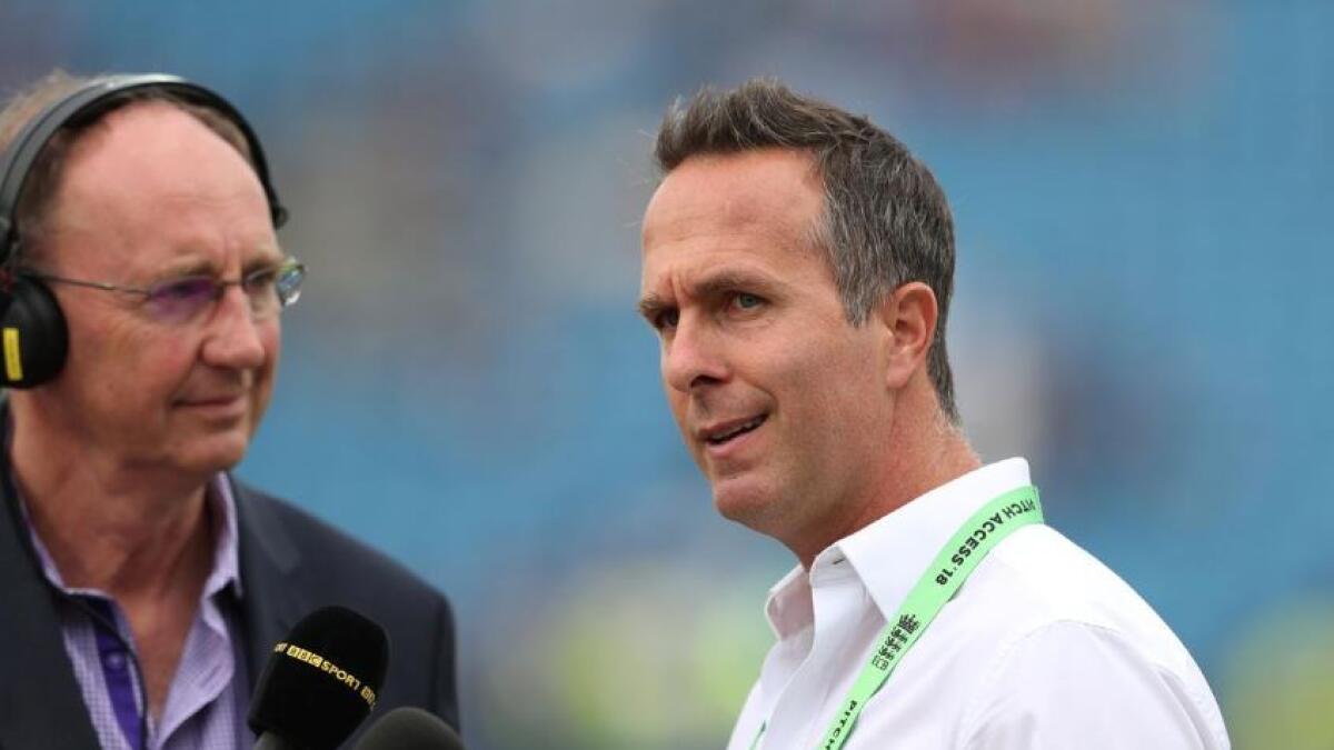 Radio presenter Jonathan Agnew with Michael Vaughan on the pitch. (Reuters)