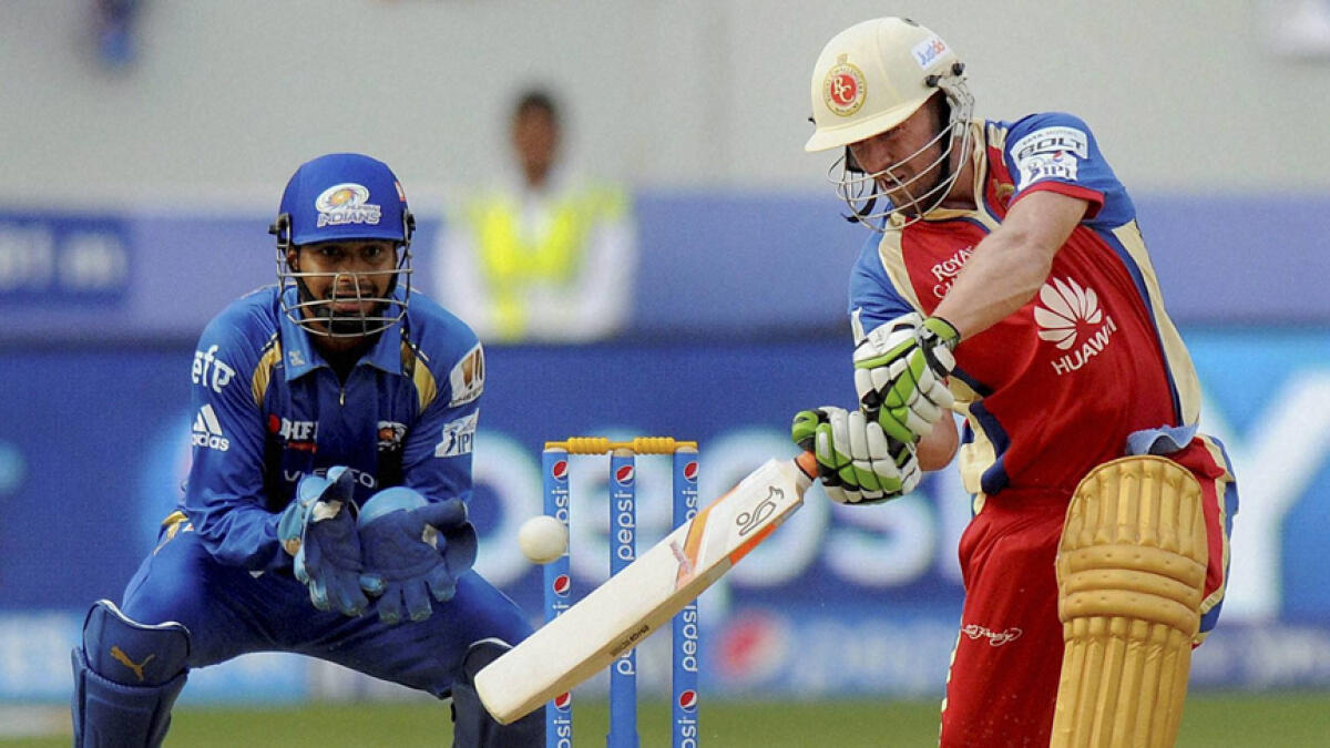 Royal Challengers Bangalore batsman AB de Villiers plays a shot against Mumbai Indians during an IPL match at the Dubai International Cricket Stadium. - PTI file