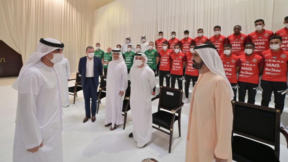 Sheikh Mohammed with members of the Shabab Al Ahli Football Club. (Dubai Media Office Twitter)
