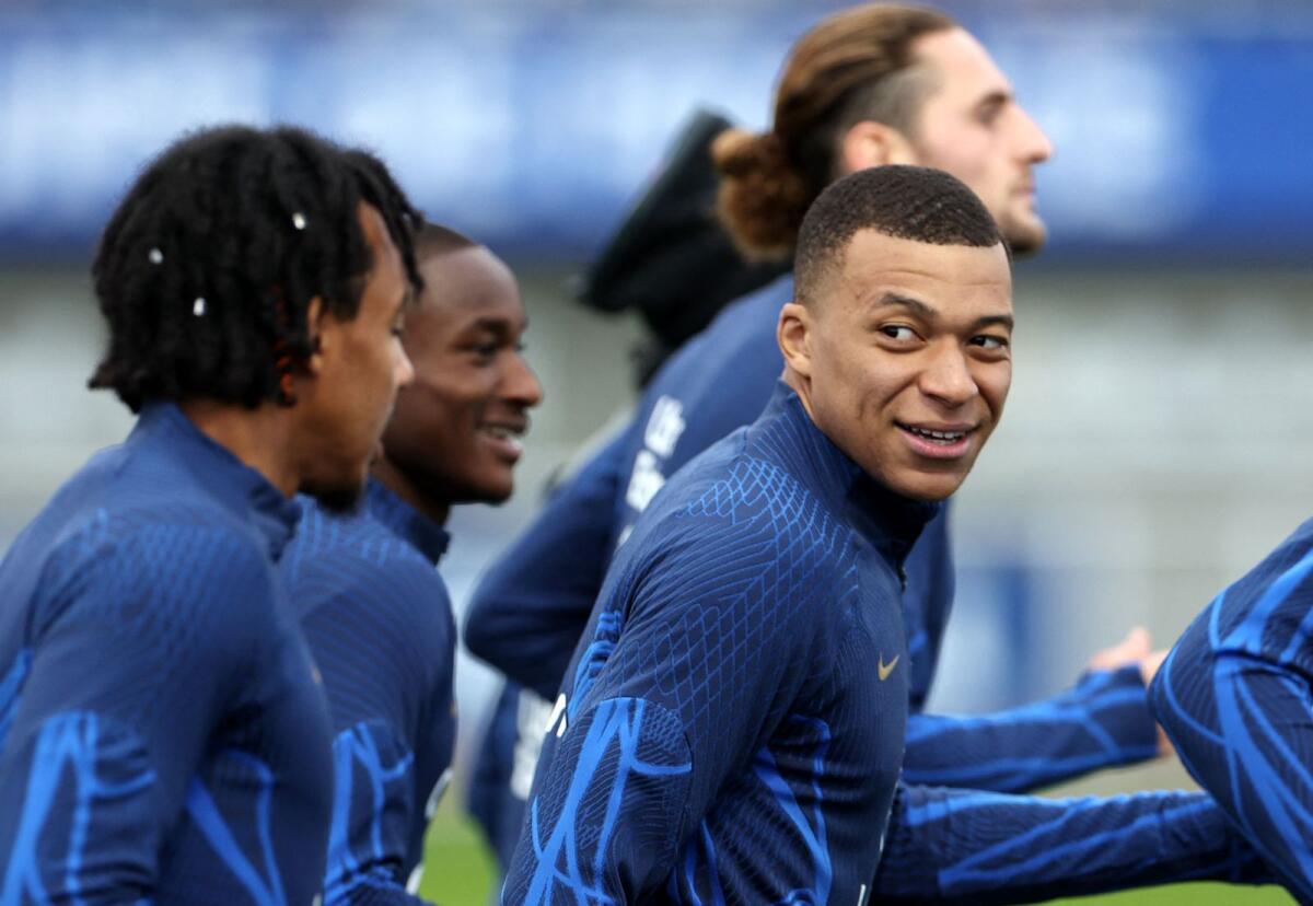 France's forward Kylian Mbappe takes part in a training session in Clairefontaine-en-Yvelines. — AFP