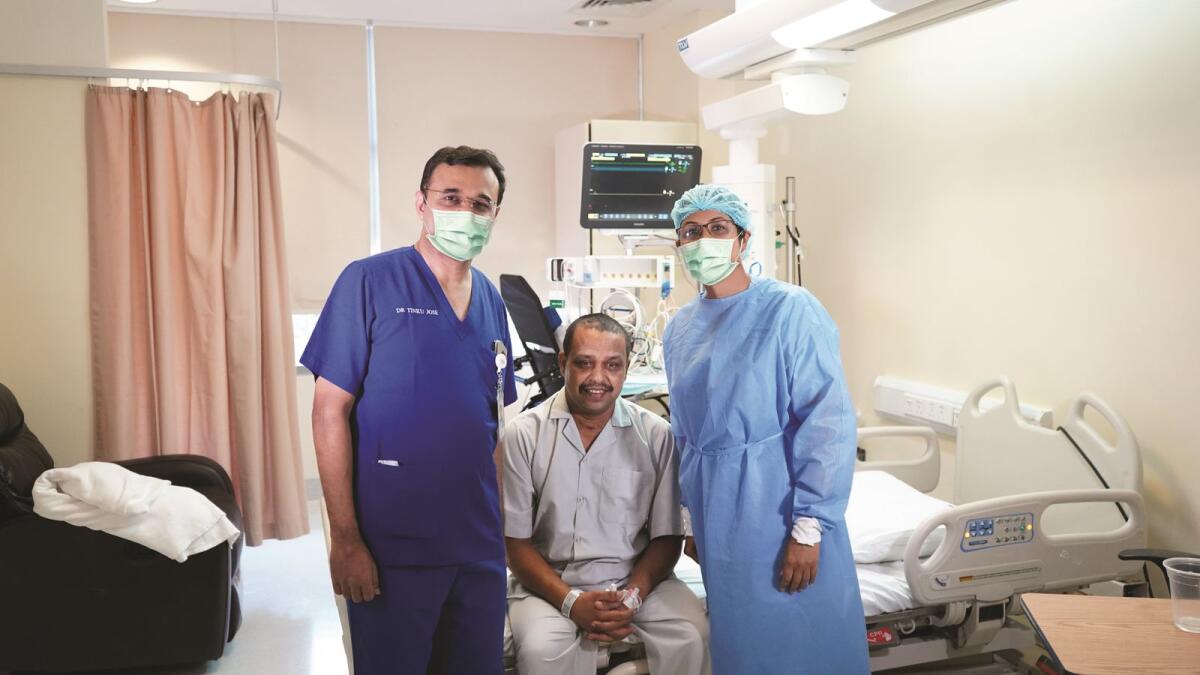 Dr Tinku Jose Kurisinkal with the patient and a staff member of RAK Hospital.