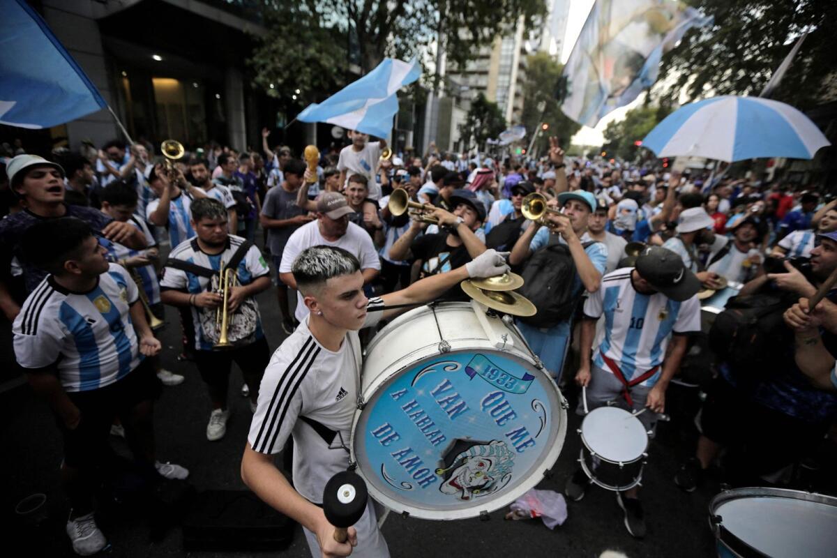 Fans of Argentina cheer for their team before the match in Buenos Aires. — AFP