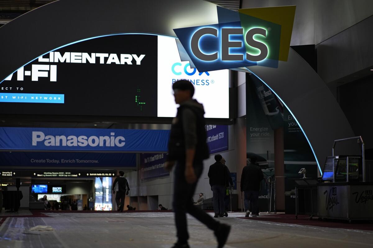 People walk through the Las Vegas Convention Center during setup ahead of the CES tech show. — AP