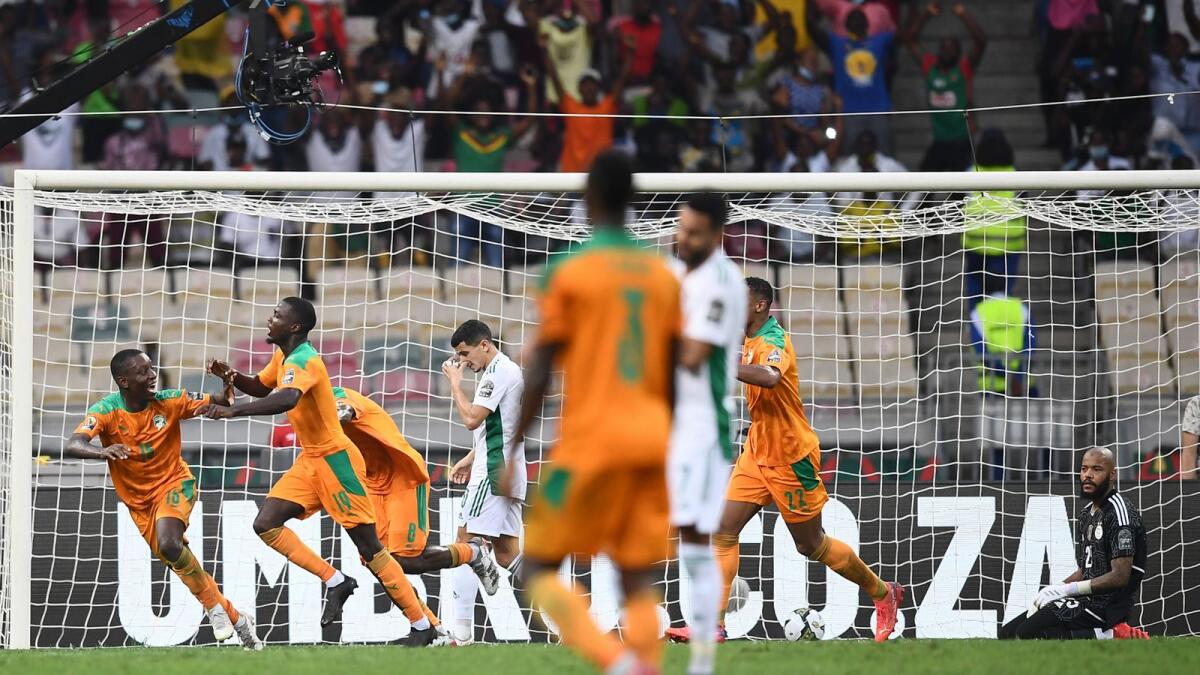 Ivory Coast's forward Nicolas Pepe (second from left) celebrates scoring his team's third goal during the Group E Africa Cup of Nations match against Algeria on Thursday. — AFP