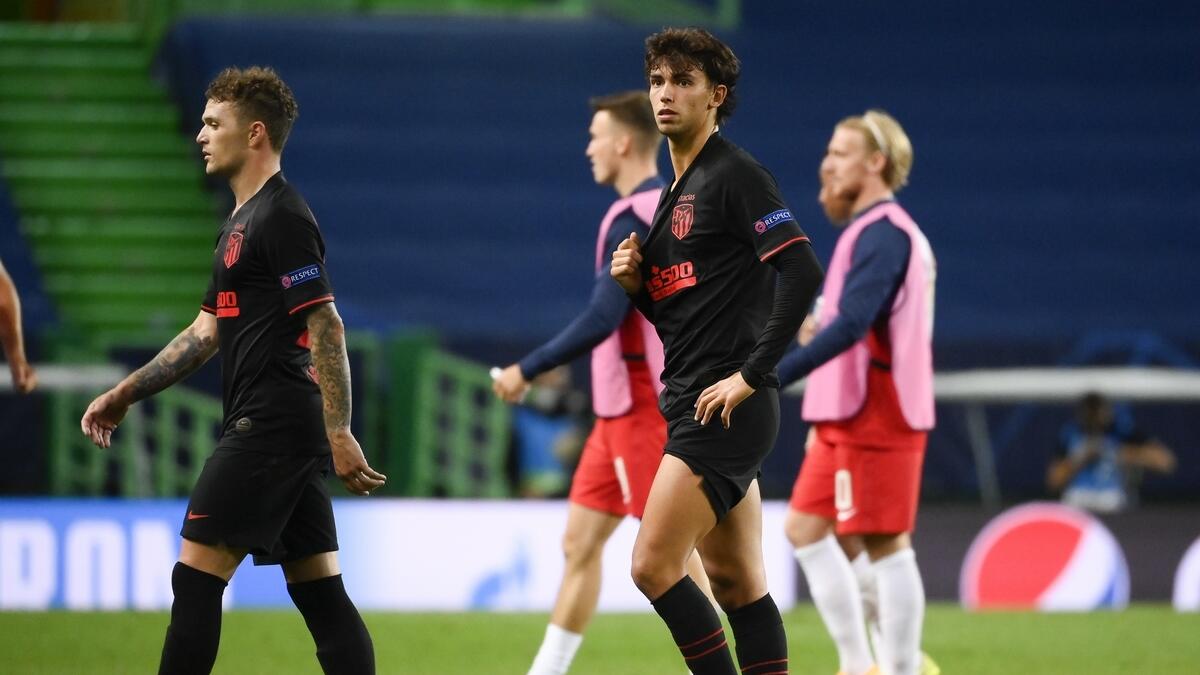 Atletico Madrid's Joao Felix (centre) leaves the pitch after the Champions League quarterfinal defeat against RB Leipzig