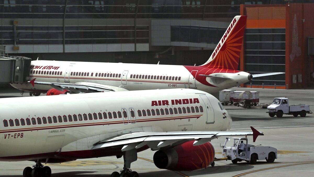 Air India planes are parked on the tarmac at the Terminal 3 of Indira Gandhi International Airport in New Delhi, India. 