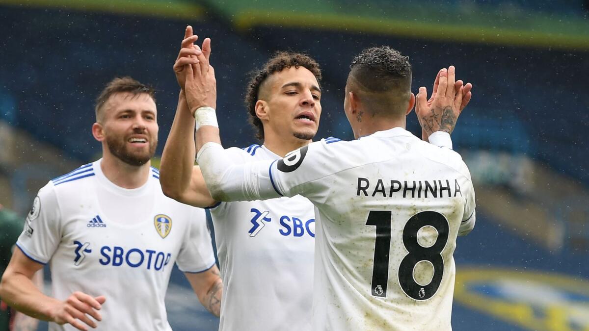 Leeds United's Rodrigo and teammates celebrate a goal against Tottenham Hotspur. — Reuters