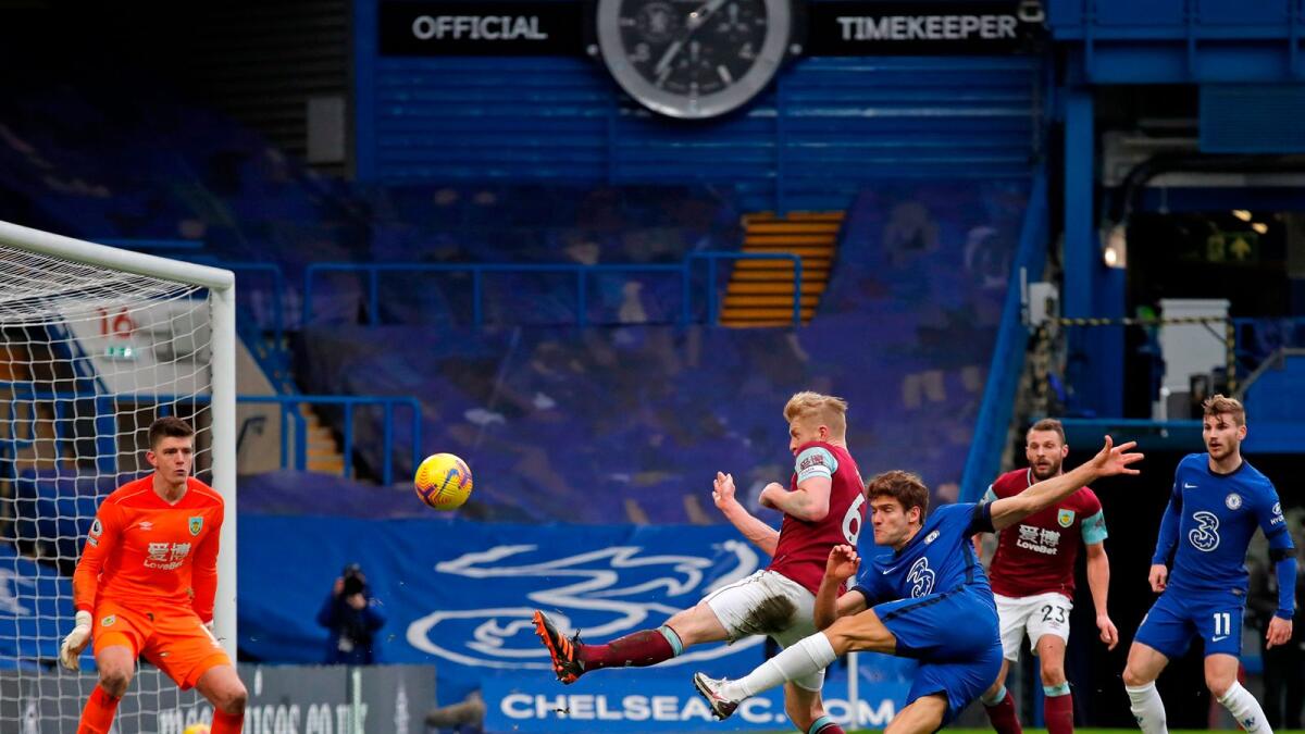 Chelsea's Spanish defender Marcos Alonso (third right) scores a goal past Burnley's English goalkeeper Nick Pope. — AFP