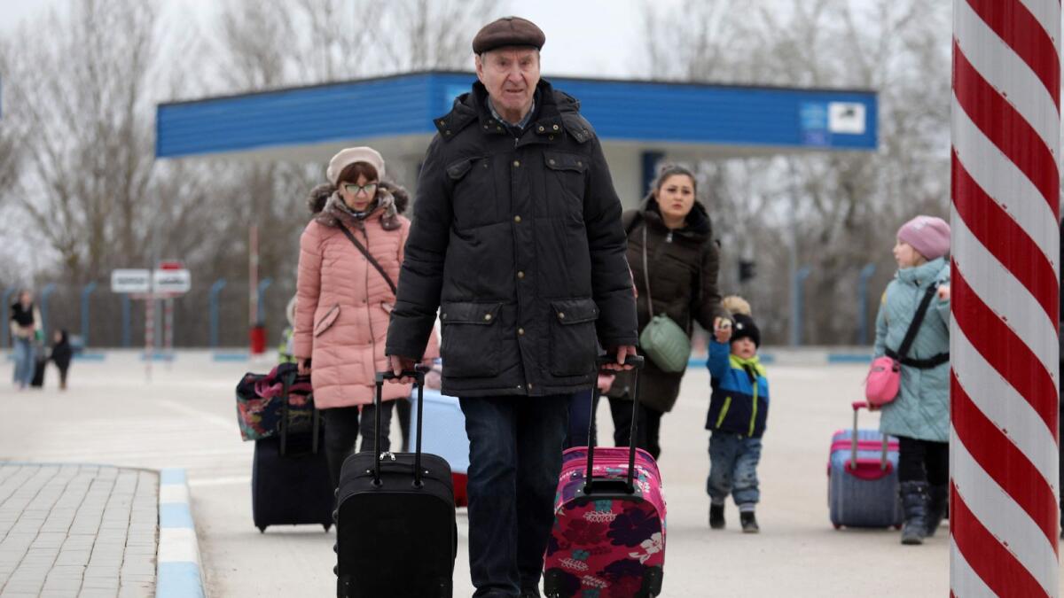People fleeing the conflict in Ukraine cross the  Moldova-Ukraine border checkpoint near the town of Palanca, on March 14, 2022, after Russia' military invasion of Ukraine. The number of refugees who have fled Ukraine since the Russian invasion began on February 24 has topped 2.8 million, the United Nations said today. Photo: AFP