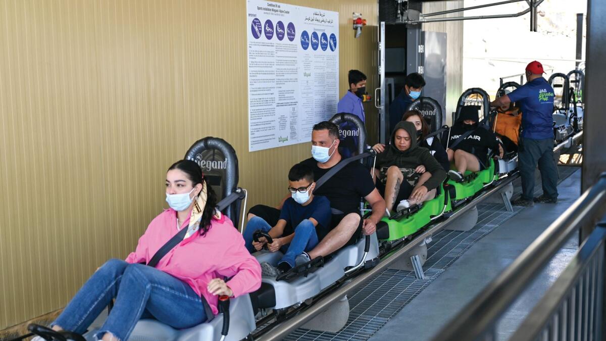 NA160222-MS-SLEDDER -- Visitors are taking a ride on Jais Sledder. A 1,885-metre toboggan runs that winds down through the Hajar Mountains officially opened to the public on Wednesday in Ras Al Khaimah. It costs Dh40 for adults for a single ride or Dh90 for three rides. For an adult and child, it's Dh60 for one go or Dh120 for three  - Photo by M. Sajjad