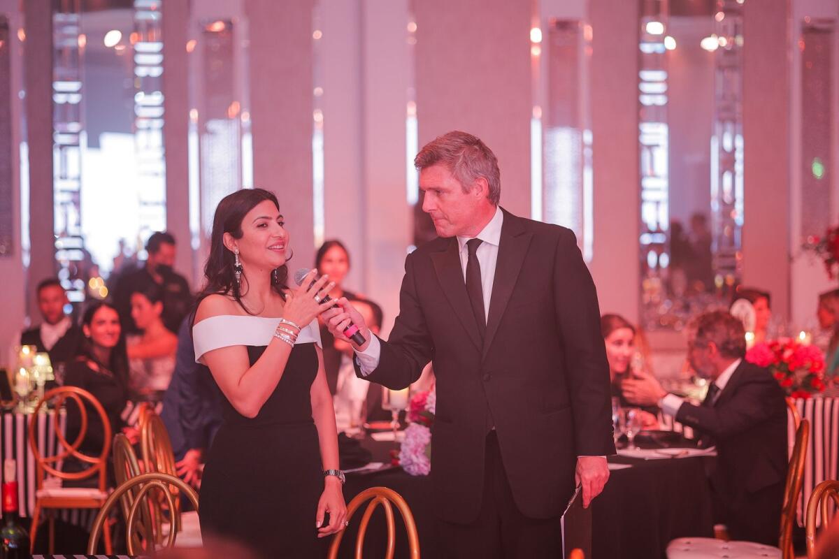 Art be a Part founder Medha Nanda with master of ceremony and auctioneer Tom Urquhart