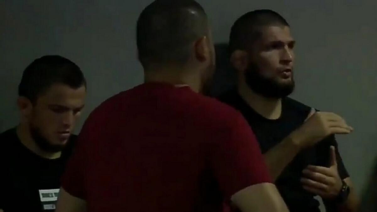 Khabib Nurmagomedov (right) made a surprise appearance at the UAE Warriors 12 mixed martial arts event. - TV Grab