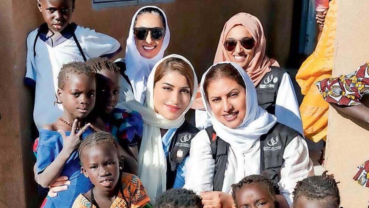 Delegates from Dubai are seen with children during their trip to Senegal. — Supplied photo