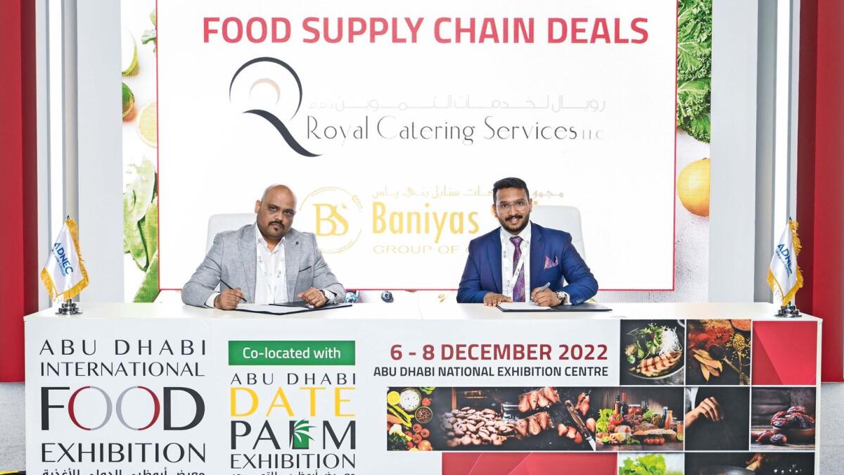 Rashid Abdurahiman, executive director, Baniyas Spike Group of Companies, signs MoU with Royal Catering Services LLC.