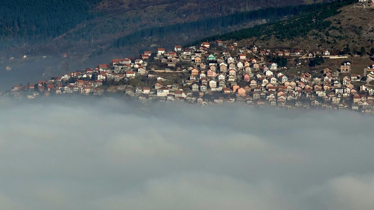 The Bosnian capital of Sarajevo is covered by layers of fog on December 17, 2020.