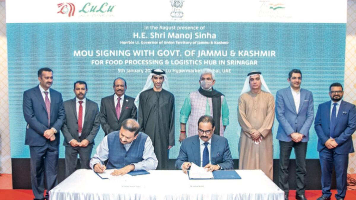 Ranjan Prakash Thakur, Principal Secretary, Industries and Commerce, Government of Jammu Kashmir, and Ashraf Ali MA, Executive Director of LuLu Group signing the MoU in the presence of Manoj Sinha, Lt. Governor of Jammu and Kashmir, Dr. Thani bin Ahmed Al Zeyoudi, UAE Minister for Foreign Trade, Dr. Ahmed AlBanna, the UAE Ambassador to India, Dr. Aman Puri, Consul General of India in Dubai and Northern Emirates, and Yusuffali MA, Chairman of LuLu Group