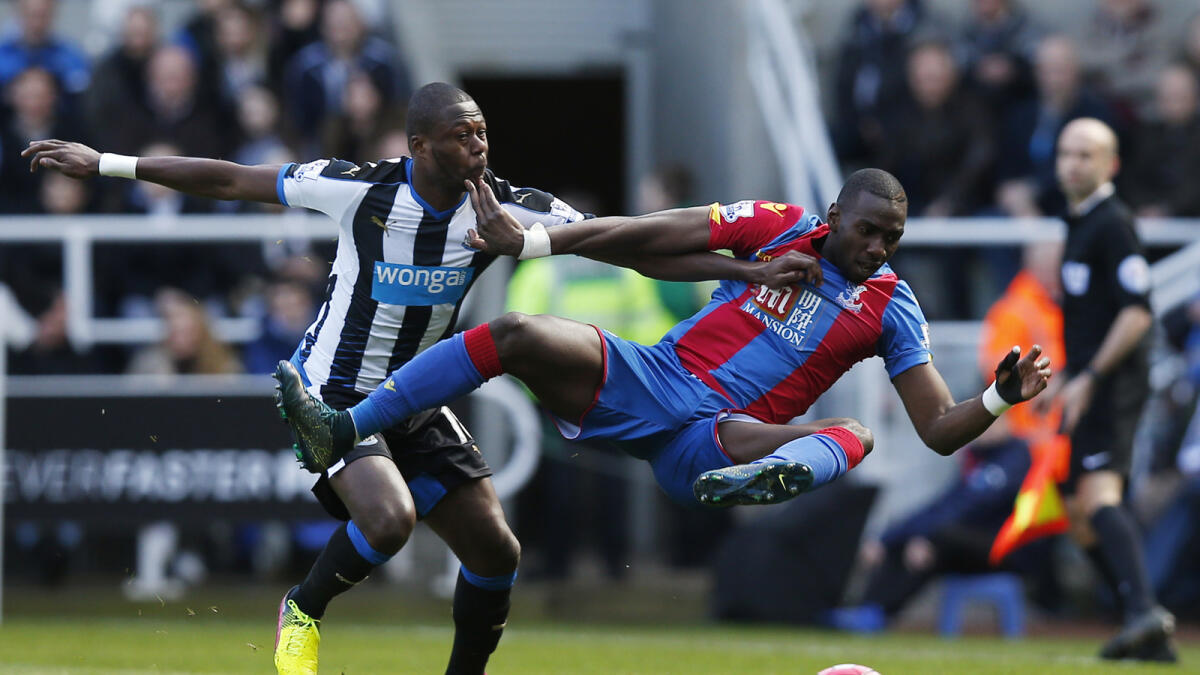 Crystal Palace’s Yannick Bolasie is fouled by Newcastle’s Chancel Mbemba during their English Premier League match on Saturday. — Reuters