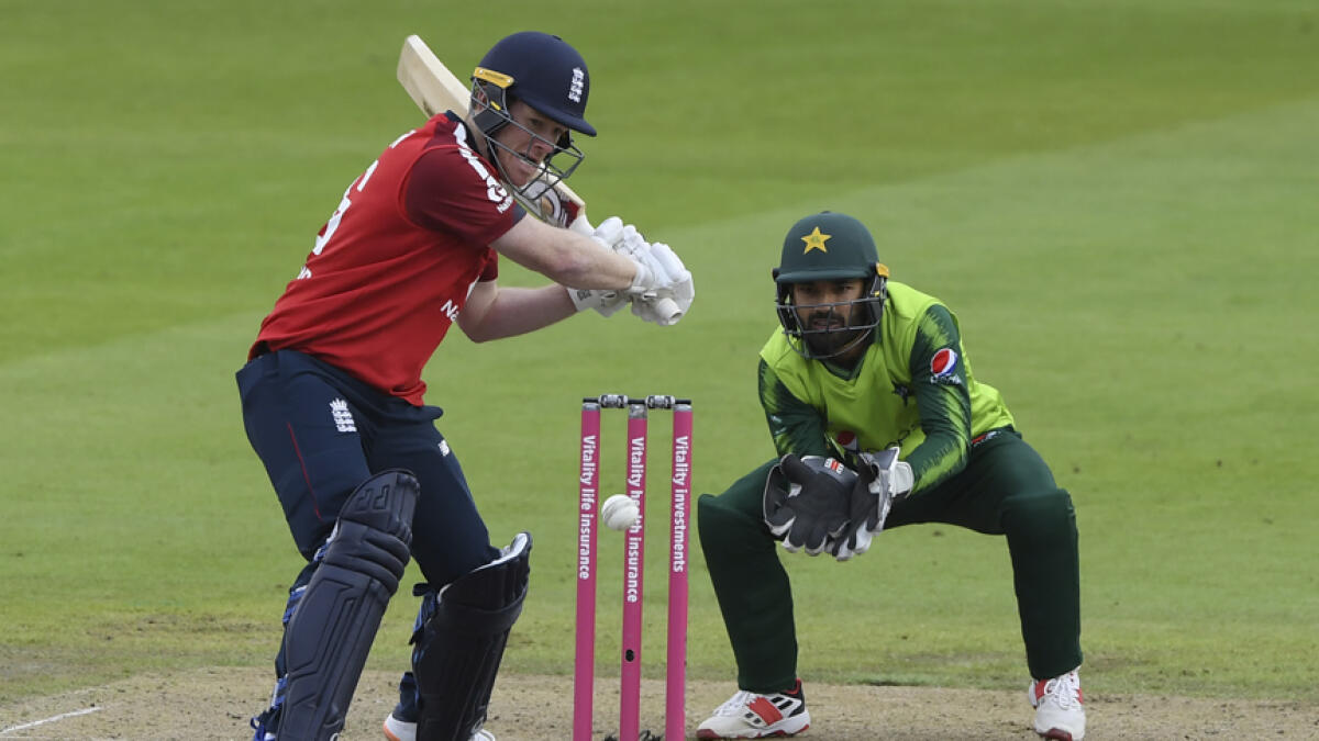 England's captain Eoin Morgan hits the ball to the boundary during the second Twenty20 cricket match against Pakistan, at Old Trafford in Manchester on Sunday. - AP