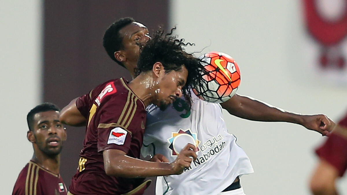 Al Wahda and Al Shabab players tussle for the ball in the Arabian Gulf League at the Al Nahyan Stadium on Sunday 