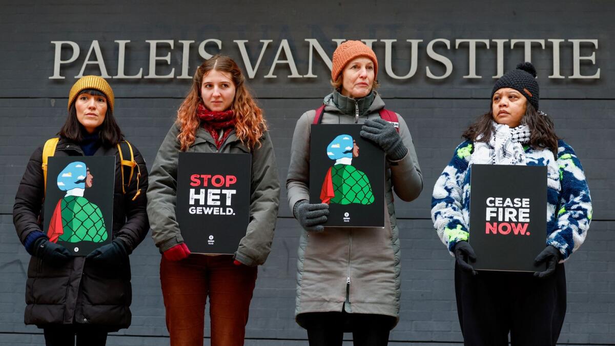 Photo: Demonstrators protest outside a district court on the day of a hearing of a case against the Dutch state launched by human rights organisations on December 4, 2023. Reuters