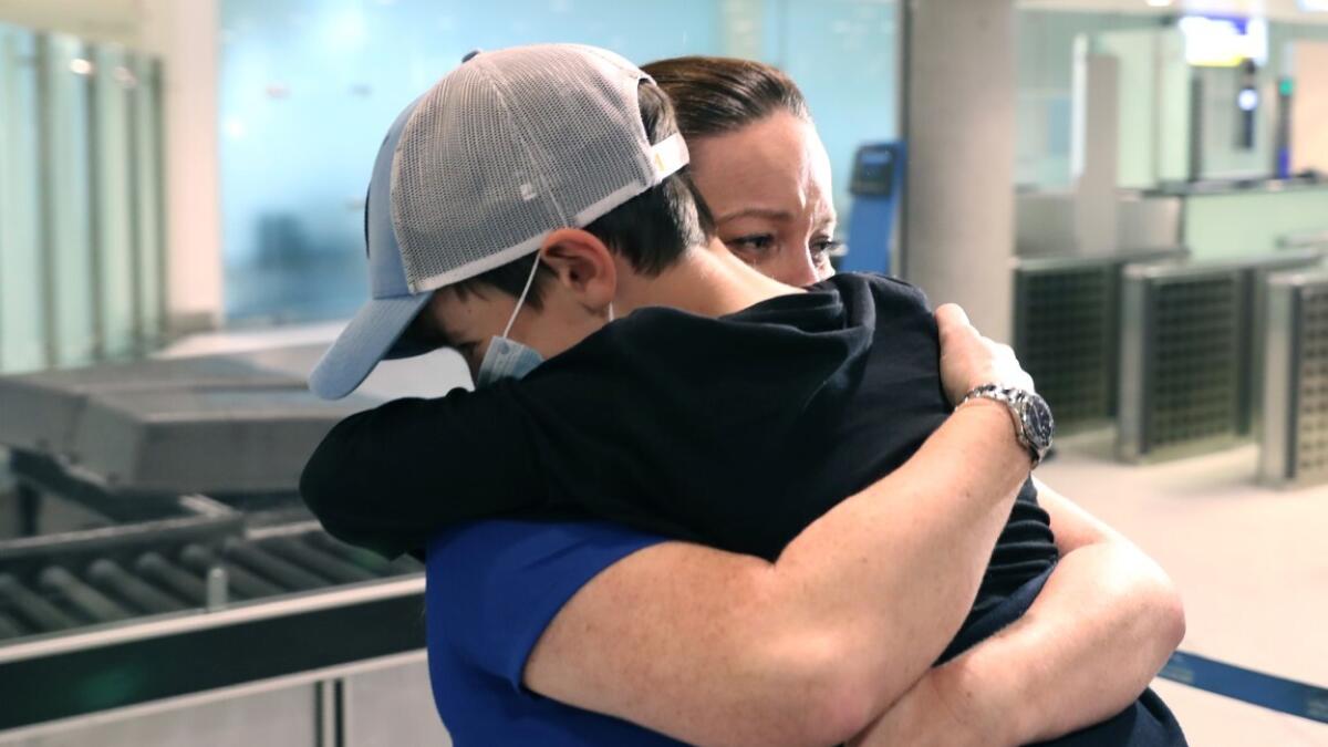 Video, Stuck, Australia, 2 months, 9-year-old boy, reunited, family, Dubai