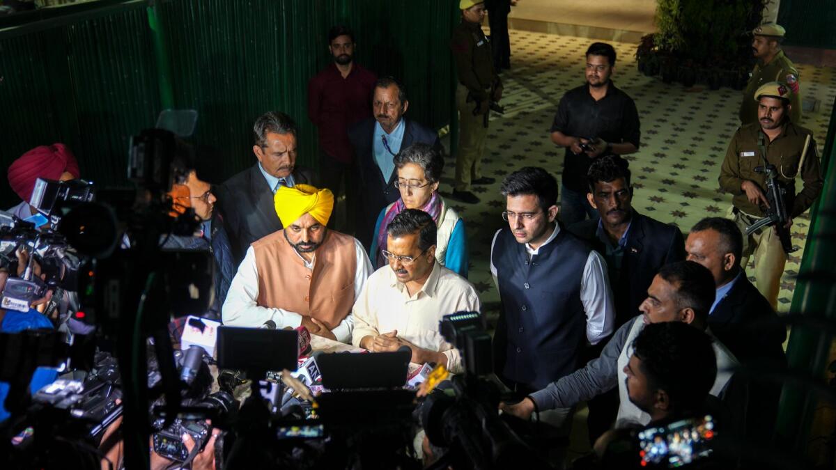 Delhi Chief Minister Arvind Kejriwal with Punjab Chief Minister Bhagwant Mann and AAP leaders Atishi Marlena and Raghav Chadha speaks with the media outside the residence of Deputy Chief Minister Manish Sisodia in New Delhi on Sunday. CBI has arrested Sisodia in connection with Delhi excise policy case. — PTI