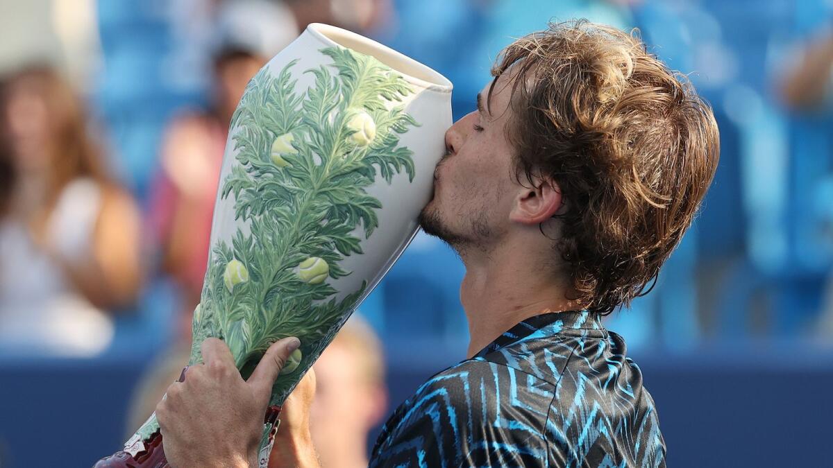 Alexander Zverev of Germany holds the winner's trophy after beating Andrey Rublev of Russia during the men's singles finals of the Western &amp; Southern Open at Lindner Family Tennis Center. — AFP