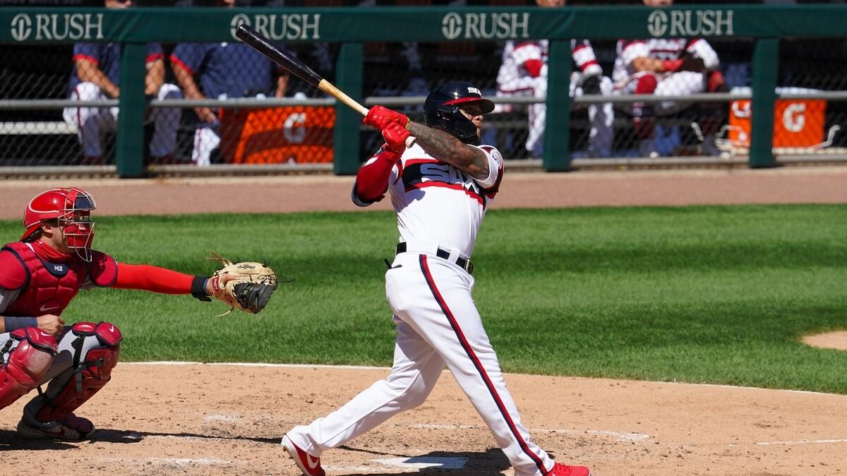 Chicago White Sox third baseman Yoan Moncada (10) hits a three run home run during the fifth inning against the St. Louis Cardinals
