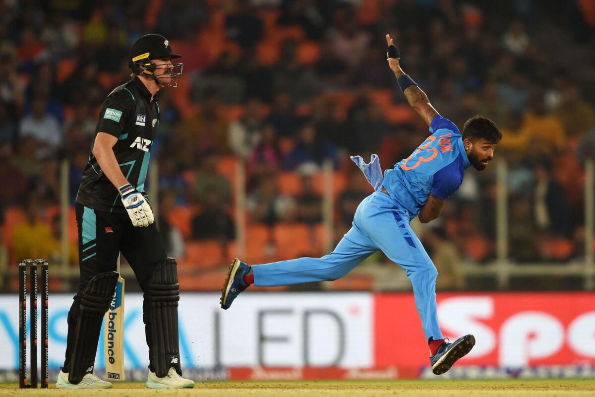 India's Hardik Pandya (right) bowls against New Zealand at the Narendra Modi stadium in Ahmedabad on Wednesday. — AFP