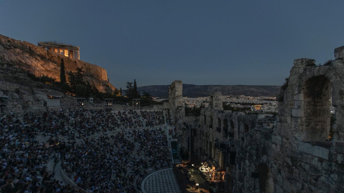 Actors and singers perform at the Odeon of Herodes Atticus in Athens after the site was reopened for performances as on the background is seen the ancient Parthenon temple. Seating limits have been imposed at the renovated ancient stone Roman theater, underneath the Acropolis, as part of restrictions to deal with the COVID-19 pandemic. Photo: AP
