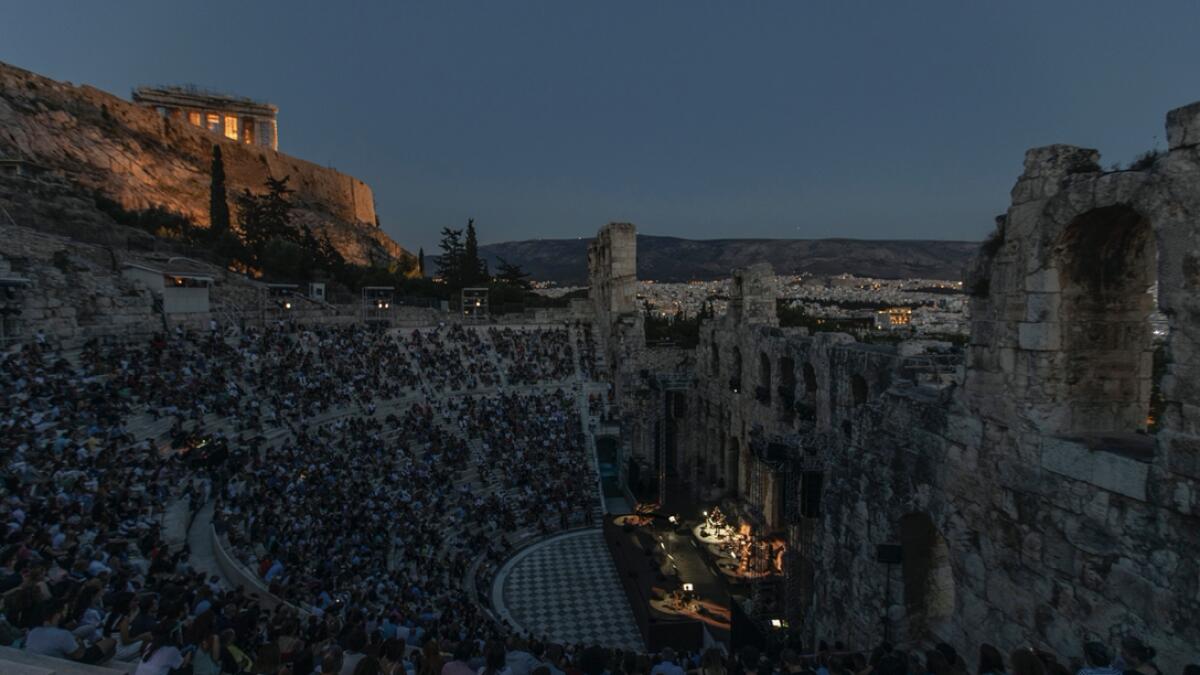 Actors and singers perform at the Odeon of Herodes Atticus in Athens after the site was reopened for performances as on the background is seen the ancient Parthenon temple. Seating limits have been imposed at the renovated ancient stone Roman theater, underneath the Acropolis, as part of restrictions to deal with the COVID-19 pandemic. Photo: AP