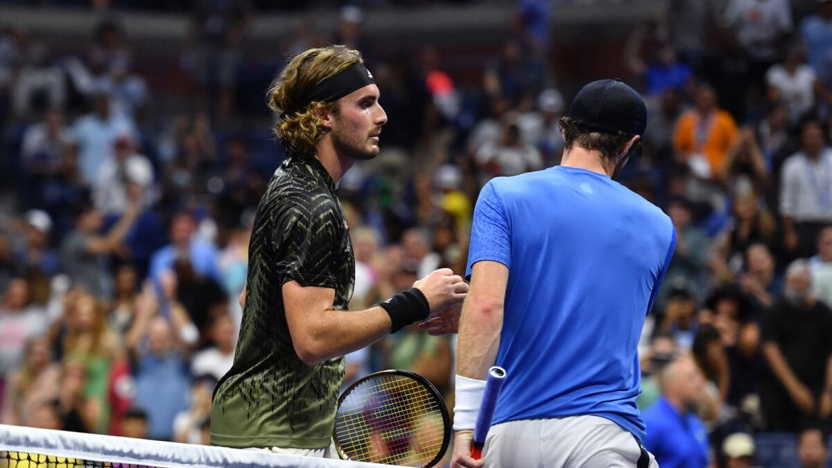 Greece's Stefanos Tsitsipas (left) shakes hands with Britain's Andy Murray after winning their US Open first round match. (AFP)