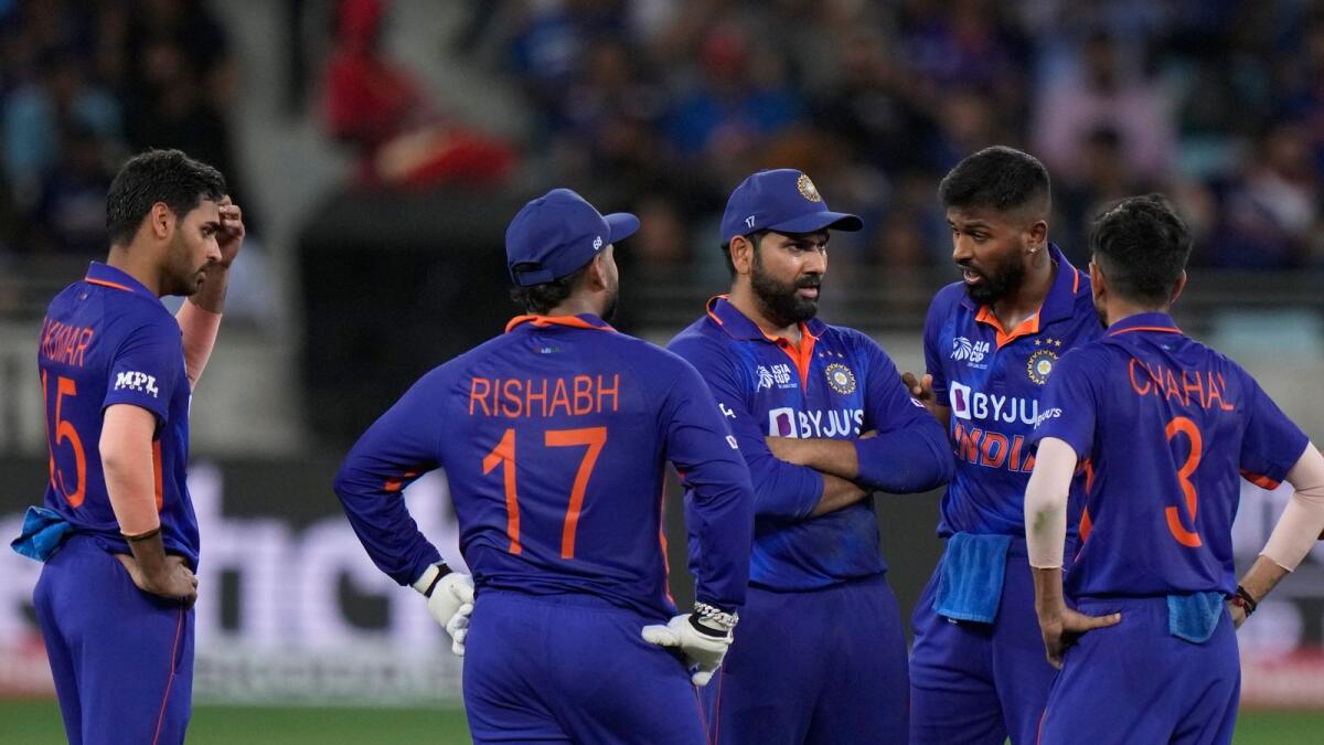 India's captain Rohit Sharma (centre) talks to his teammates. — AP