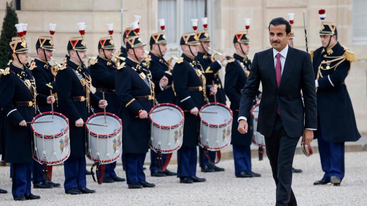 Qatar's Emir Sheikh Tamim bin Hamad Al Thani arrives at the Presidential Elysee Palace to meet with the president of France in Paris on Thursday. – AFP