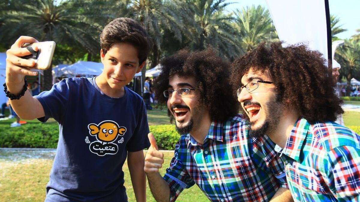 YouTube artists Abdullah and Noor pose for a selfie with a fan at a meet and greet event in Zabeel Park, in Dubai.- Photo by Neeraj Murali/Khaleej Times