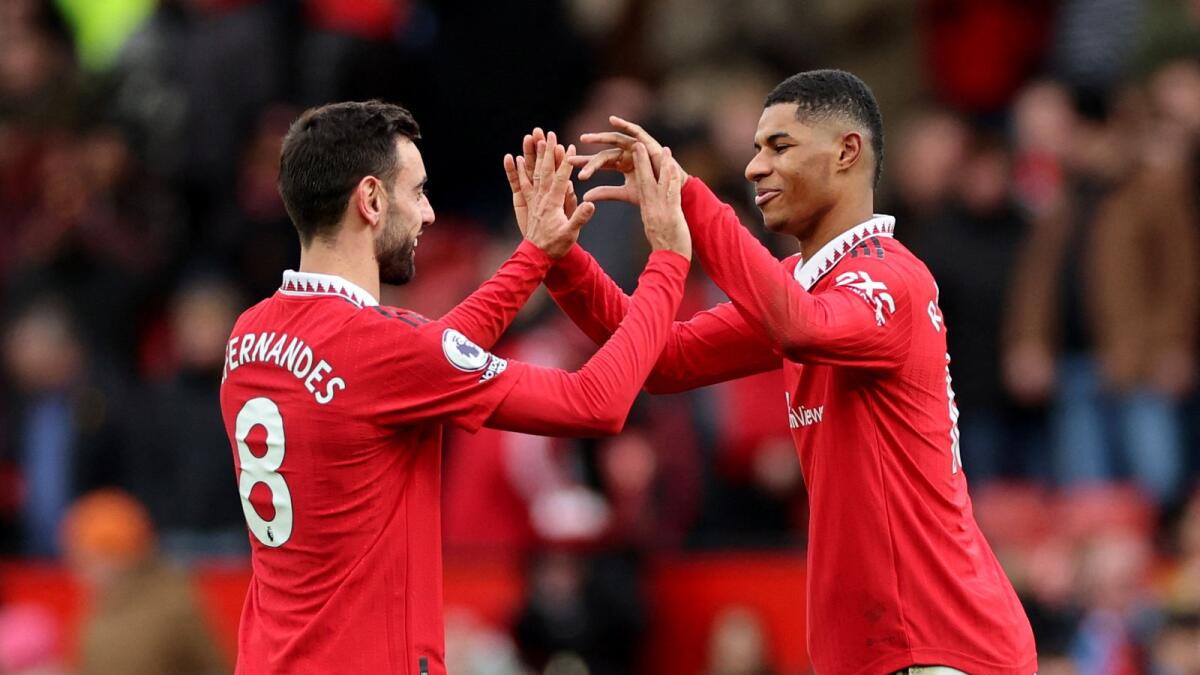 Manchester United's Bruno Fernandes and Marcus Rashford (right) celebrate after the match. — Reuters