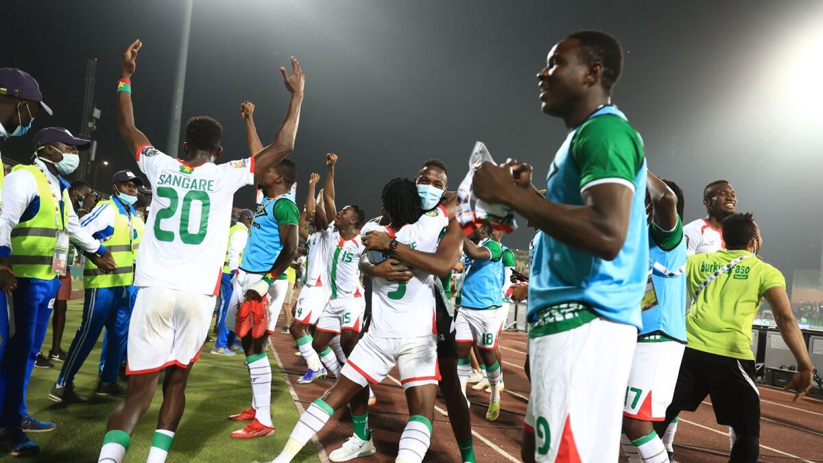 Burkina Faso's players celebrate their victory over Tunisia and their qualification for the semifinals. (AFP)