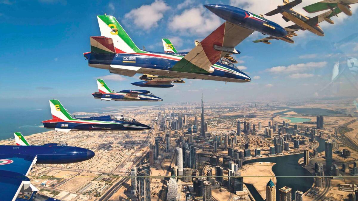 Al Fursan and Frecce Tricolori, aerobatic teams of the UAE and Italy, flying together over Dubai. 	— Photos credit: Italian Air Force