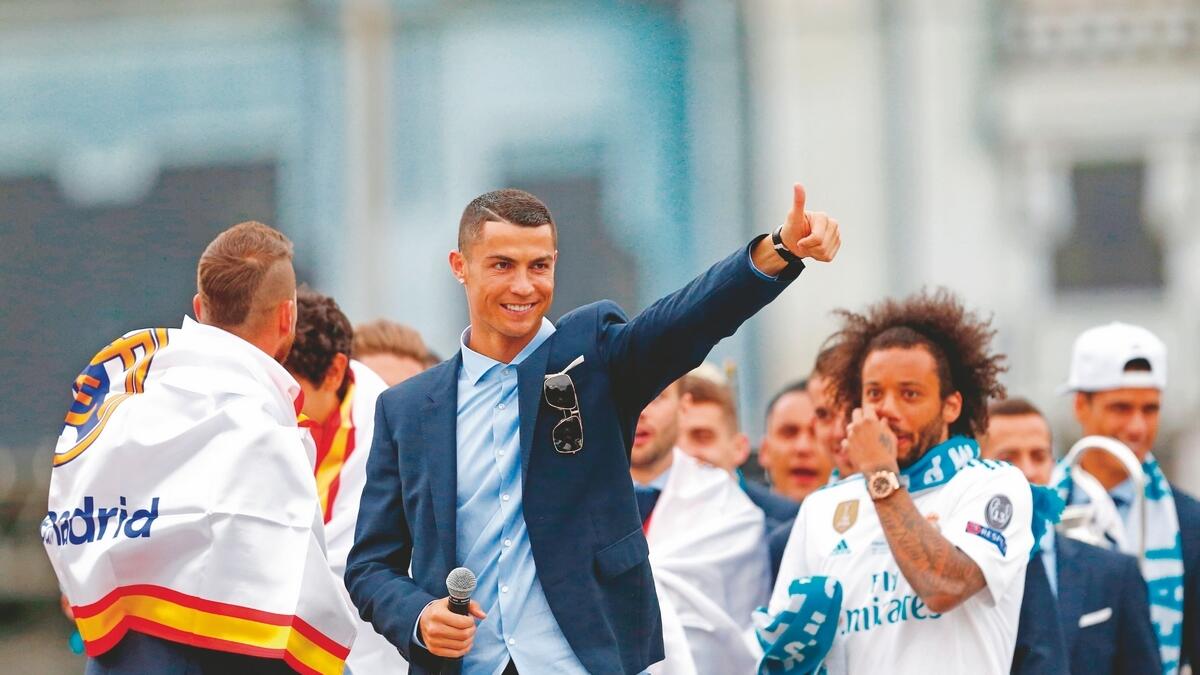 Ronaldo presents happy face as Real celebrate