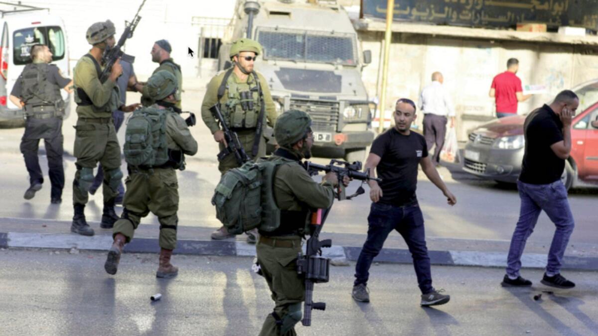Palestinians confront Israeli soldiers who stormed Huwara, Israeli-occupied West Bank. — Reuters