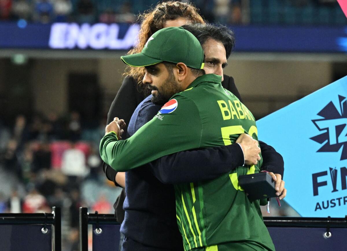 Pakistan captain Babar Azam (centre) is embraced by PCB chairman Ramiz Raja after the final. — AFP