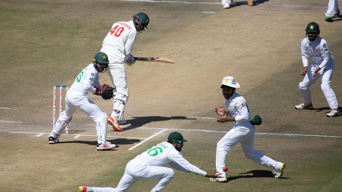 Pakistan captain Babar Azam (centre) drops a catch during the second Test against Zimbabwe.— AP
