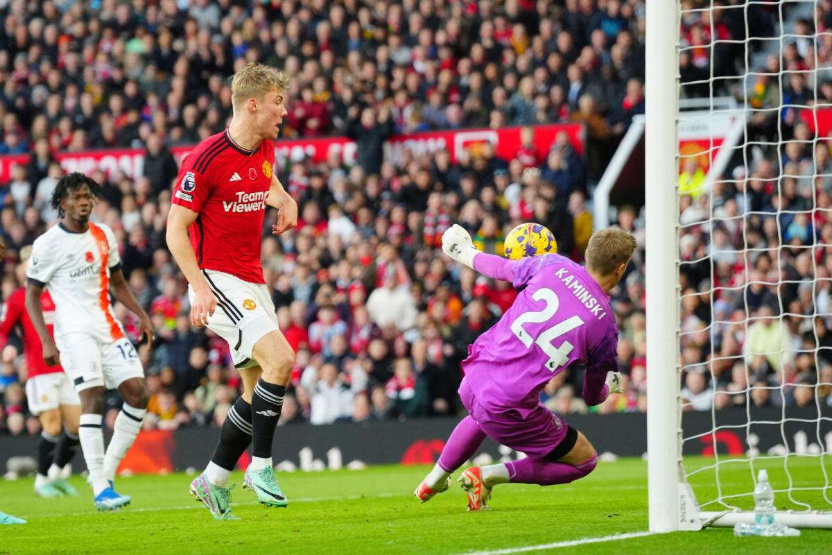 Manchester United's Rasmus Hojlund, centre, makes an attempt to score past Luton Town's goalkeeper Thomas Kaminski . - AP