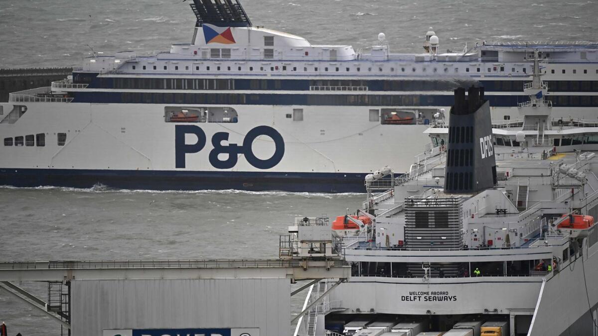 Freight lorries are seen aboard a docking DFDS ferry as a P&amp;O ferry arrives at the port of Dover on the south coast of England.  — AFP file photo