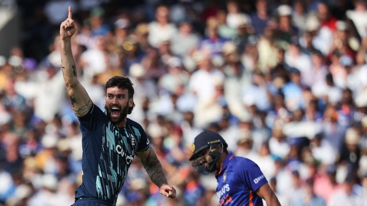 England's Reece Topley celebrates after dismissing Indian captain Rohit Sharma during the second One Day International at Lord's on Thursday. — AFP