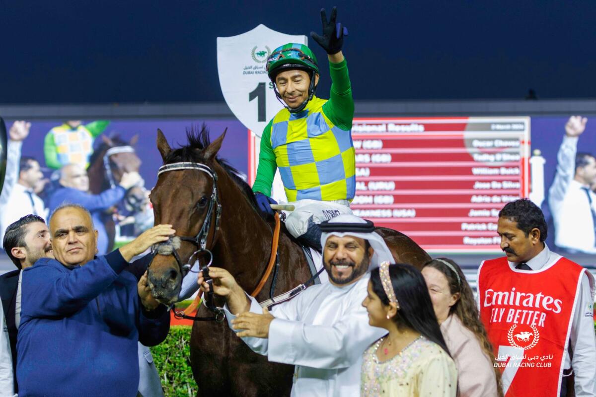Trainer Musabeh al Mheiri, owner Nasir Asker and jockey Oscar Chavez celebrate in the Meydan winner's enclosure after Military Law's success. - Photo by DRC