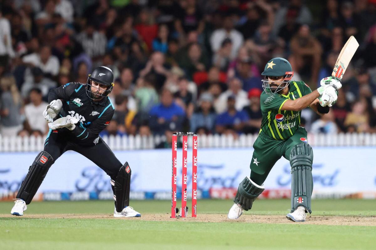 Pakistan's Babar Azam (right) plays a shot. — AFP