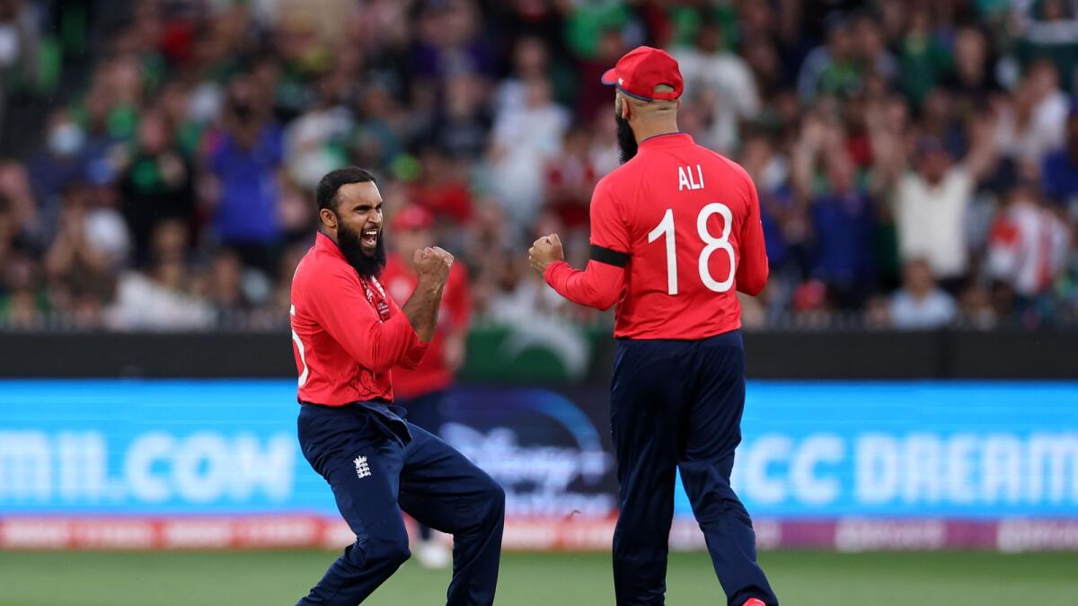 England's Adil Rashid (left) celebrates with teammate Moeen Ali at the Melbourne Cricket Ground on Sunday. — ICC