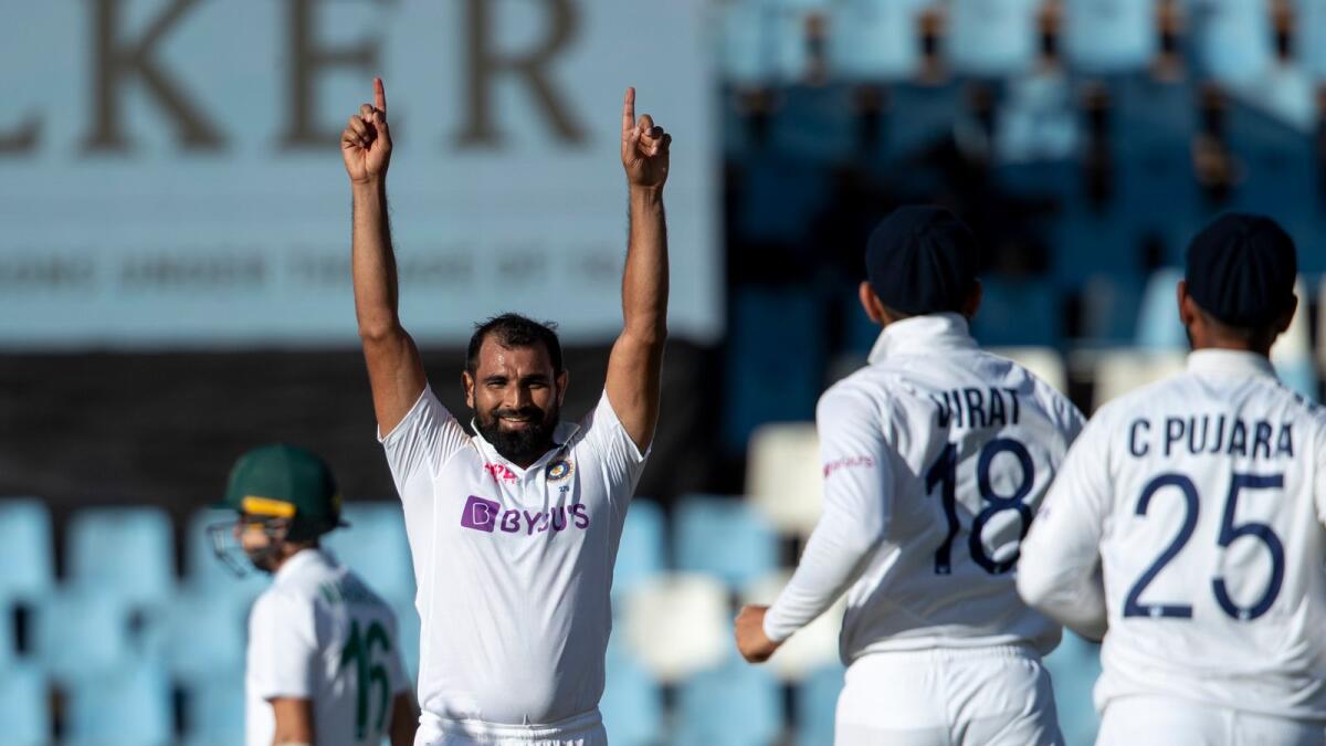 India's fast bowler Mohammed Shami reacts after taking his 200th Test wicket. (AP)